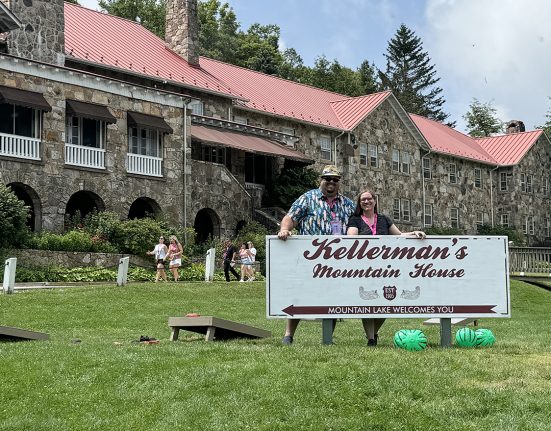 Craig and Wendy behind Kellermans sign Mountain Lake Lodge Virginia