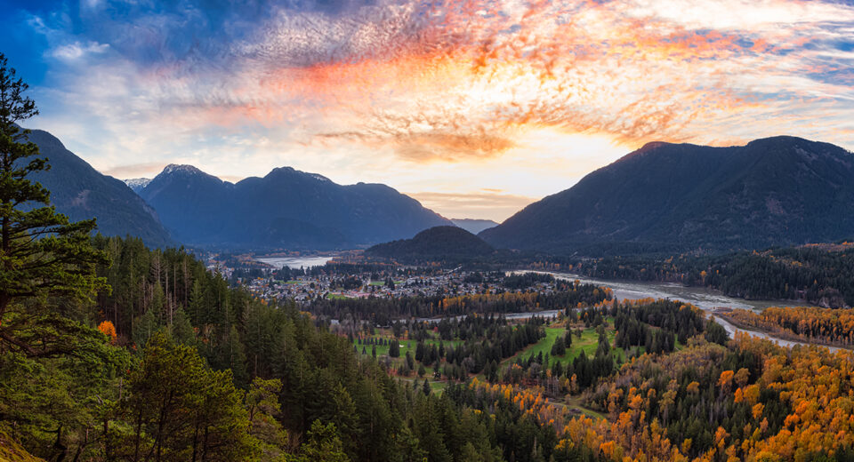 Panoramic View of modern city, Hope, in British Columbia, Canada. Sunny Fall Season. Colorful Sunset Art Render. Thacker Mountain Hike Viewpoint. Background Panorama